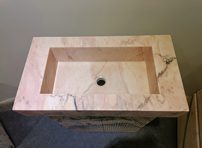 Pink marble bathroom vanity
