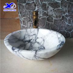 white marble round sink