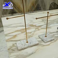 Gold and marble jewelry stand