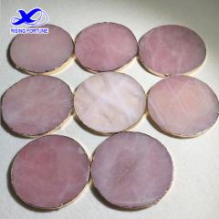 Round rose quartz crystal slice coasters